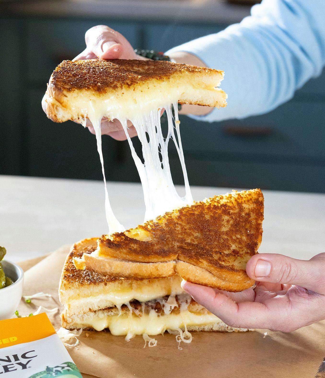 Organic Valley Flavor Favorites sliced cheese on bread to make a grilled cheese.